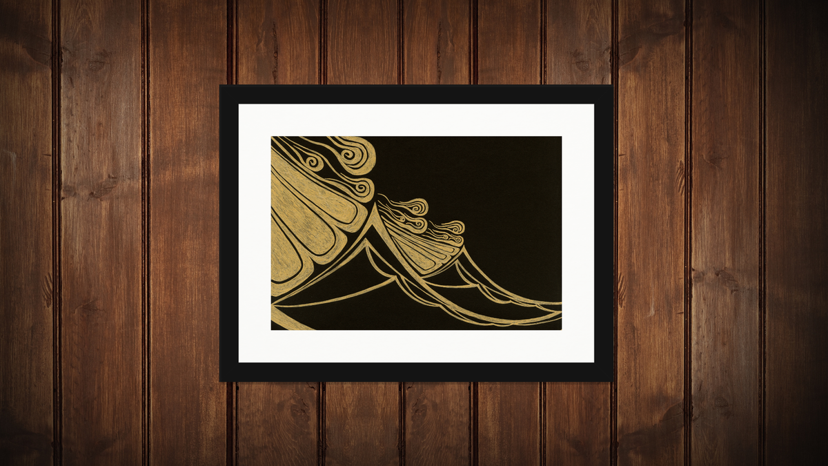 Framed abstract wall art featuring flowing gold line patterns on a black background, displayed in a black frame with a white mat against a dark brown wood-paneled wall.